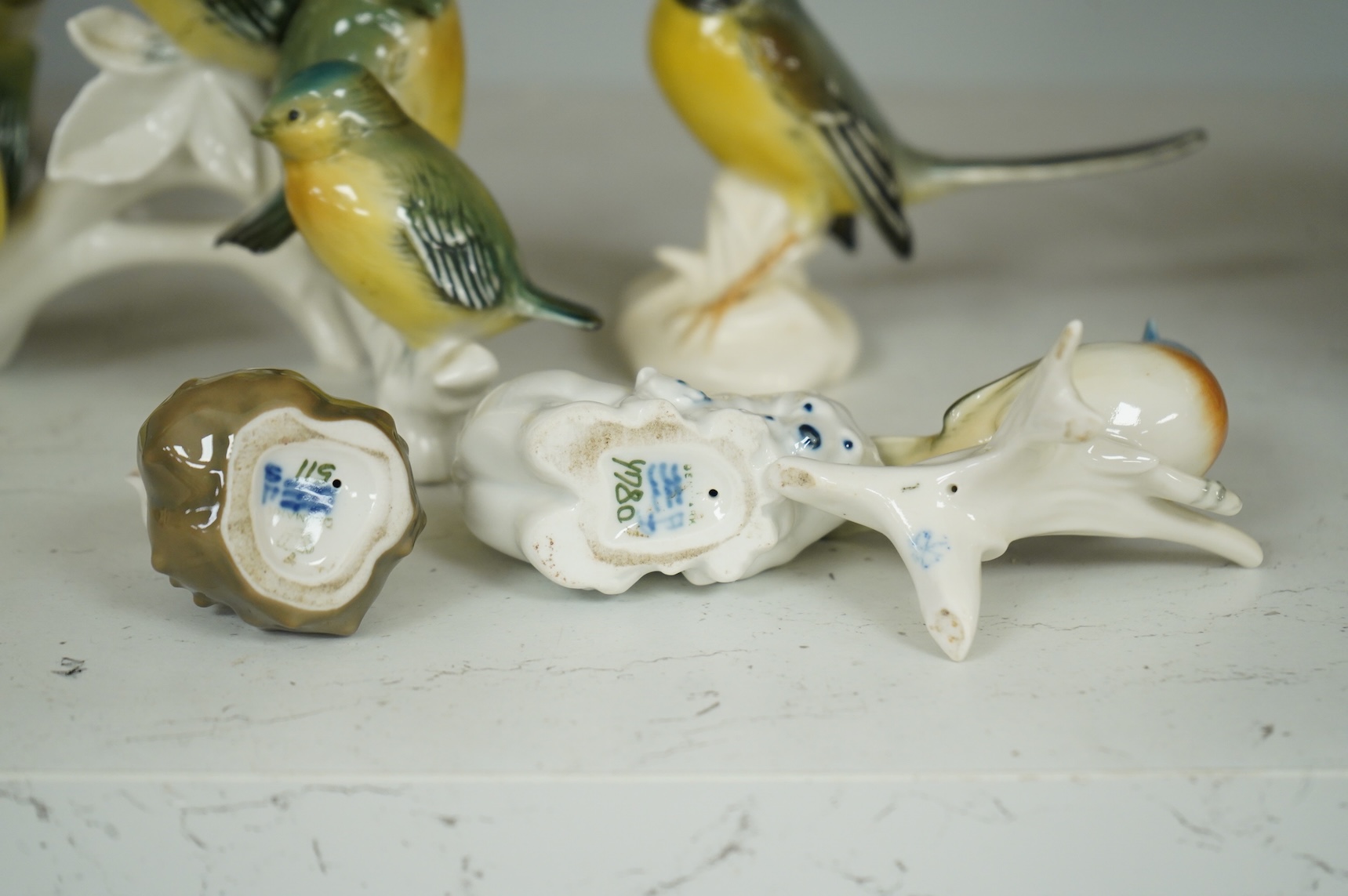 A collection of Copenhagen and other German porcelain birds, tallest 20cm